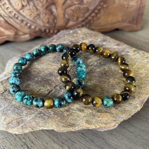 Set of 2 natural gemstone bracelets featuring African turquoise and tiger eye, designed to share and match with someone special.