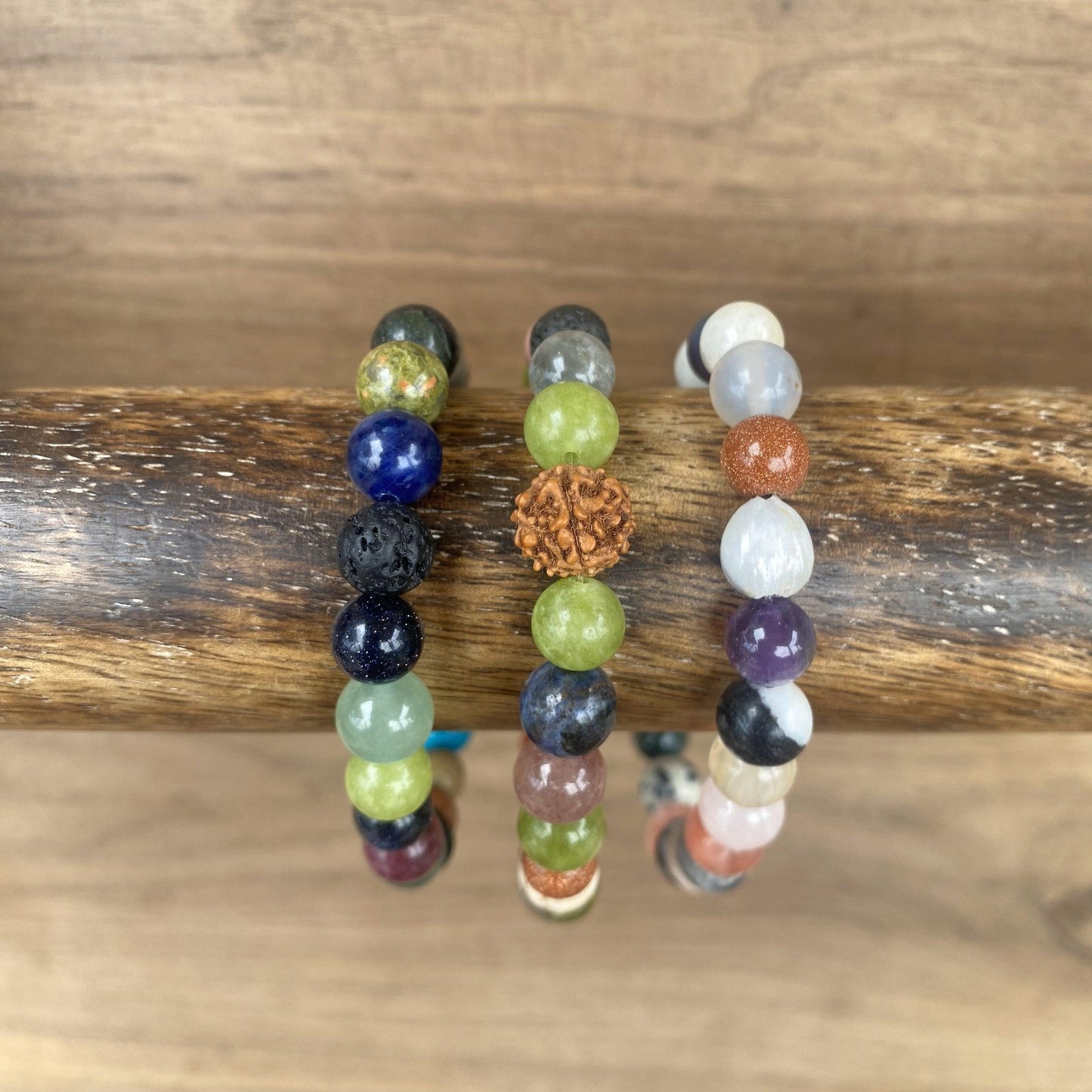 Natural gemstone beaded bracelets featuring lava rock, rudraksha seed essential oil diffusers, and Job's Tear seed options for aromatherapy